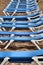 Blue hammocks lined up on Levante Beach in Benidorm