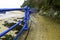 Blue hand rails leading from a beach