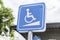 Blue Handicap at parking car sign outdoors for Disabled, Wheelchair or elder old or cannot self help people