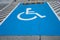 Blue Handicap at parking car sign outdoors for Disabled, Wheelchair or elder old people.