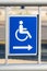 Blue handicap sign with an arrow