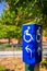 Blue handicapped wheel chair post sign