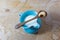 Blue handmade ceramic pitcher of cashew milk, wooden spoon with single cashew balanced on top