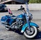 A Blue Harley Davidson Road King Motorcycle with white wall tires