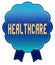 Blue HEALTHCARE ribbon badge.