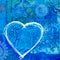 Blue heart on collage background