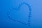 Blue heart shape of water droplets