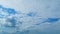 Blue Heaven Summer Cloudscape. Rolling Puffy White Layered Clouds Are Moving. Tropical Summer Sunlight. Tropical Sky At