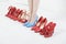 In Blue High Heels Amid Red Shoes