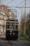 blue historical streetcar driving at the lange vijverberg in The