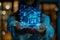 a blue hologram of a house on hand of business woman, closeup