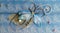 Blue horizontal handmade greeting decoration with shiny beads, embroidery, silver thread in form of flower and butterfly