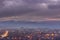 Blue hour dramatic sky over misty cityscape