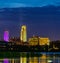 Blue hour Night scene of reflections of buildings in 2019 Missouri River flooding of Harrah`s Casino parking lot in Council Bluffs