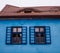 Blue house facade with blue windows shades