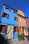 Blue, house, neighbourhood, sky, property, building, town, residential, area, home, architecture, facade, window, apartment, balco