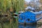 Blue houseboat on the channel in London