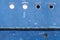 Blue hull of old ship texture with round portholes