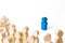 Blue human figurine in the spotlight of a crowd of people. Leader, leadership, head of organization or community. Organization