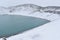 The blue Hverfjall Crater in spring with snow in background in Myvatn, Iceland