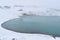 The blue Hverfjall Crater in spring with snow in background in Myvatn, Iceland