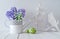 Blue hyacinth and lily of the valley flowers, wooden heart, bird