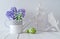 Blue hyacinth and lily of the valley flowers, wooden heart, bird and green Easter eggs