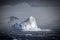 Blue ice berg in stormy seas, Antarctic Sound