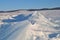 The blue ice of Lake Baikal. Baikal in winter. Transparent and clean ice of Lake Baikal.