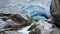 Blue ice of Nigardsbreen glacier arm in Autumn in Norway