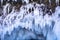 Blue ice stalactite on cliff, winter season in Siberia, Russia