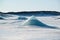 Blue iceberg pyramid on a frozen glacial lake at Skaftafellsjokull glacier, winter Iceland