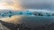 Blue icebergs at Jokulsarlon glacier lagoon in iceland, sunset colors reflect on water