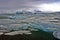 Blue Icebergs of Jokulsarlon with Snaefell Mountain, Iceland