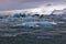 Blue Icebergs of Jokulsarlon with Snaefell Mountain, Iceland