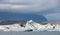 Blue icebergs, lagoon and storm