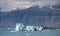 Blue icebergs, lagoon and tourist boat