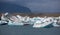 Blue icebergs, lagoon and tourist boat
