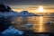Blue icebergs, mountains and polar sun reflecting in sea lagoon