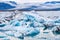 Blue Icebergs in Ocean Water. Glacier Ice Drift at Calm Water. Pure Ice Chunks from Melting Glacier. Foggy Weather in Iceland