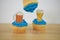 Blue iced cup cakes with mini beer glass decorations