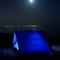 Blue illuminated tent at night