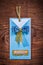 Blue invitation paper envelope on wooden board