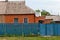 Blue iron fence and wicket door with covered slate