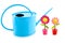 Blue iron watering can with wooden flowers