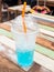 Blue italian soda in plastic cup