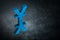 Blue Japanese of Chinese Currency Symbol or Sign With Mirror Reflection on Dark Dusty Background