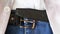 Blue jeans with black leather belt