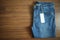 Blue jeans with blank white price label tag