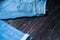 Blue jeans on a brown wooden background.